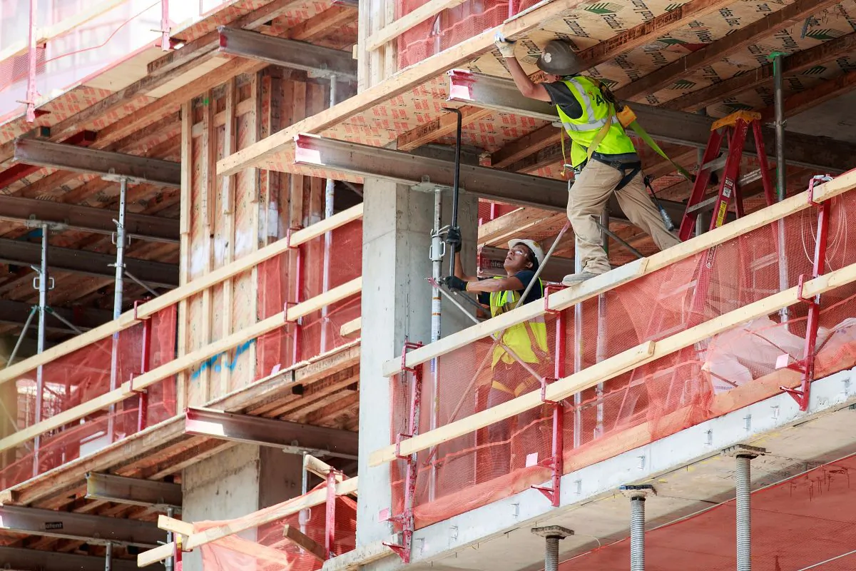 Construction laborers on a new residential building in the Brooklyn, New York City on Aug. 16, 2016. (Drew Angerer/Getty Images)