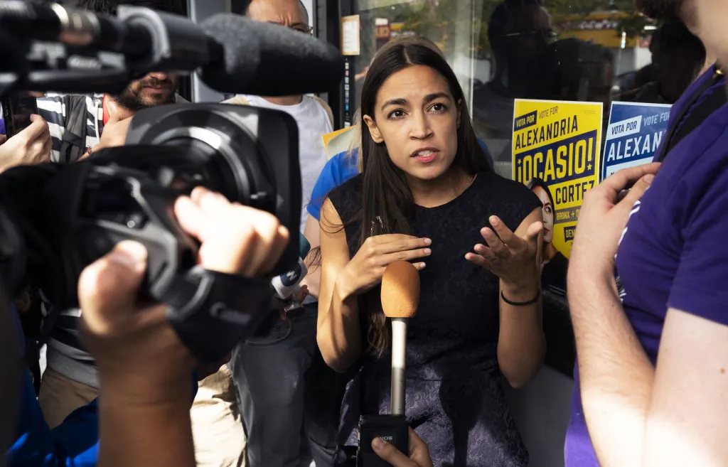 Democratic congressional candidate Alexandria Ocasio-Cortez speaks with  reporters after her general campaign kick-off rally on Sept. 22, 2018 in the Bronx borough of New York. (Don EMMERT/AFP/Getty Images)