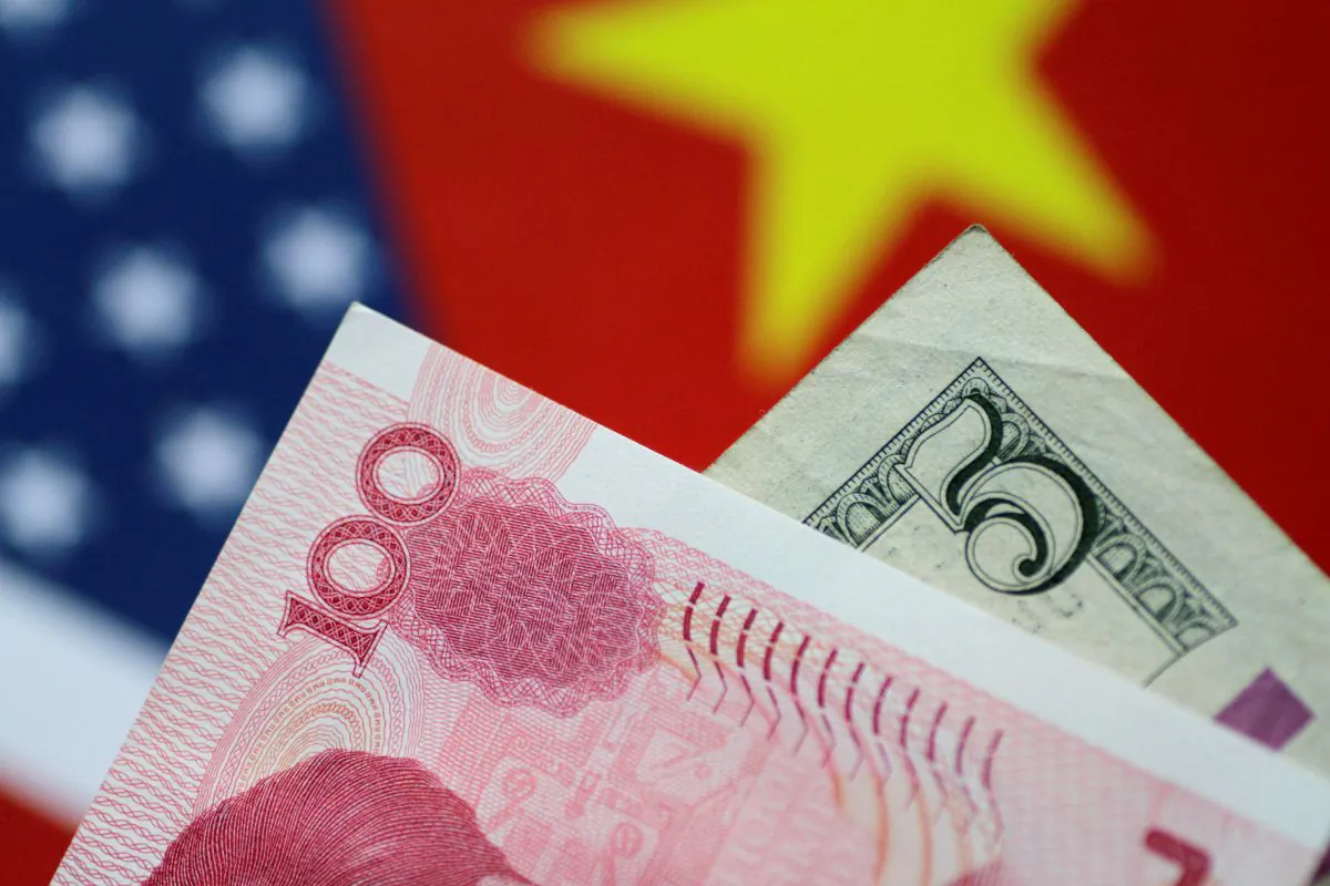 U.S. Dollar and China Yuan notes are seen in this picture illustration on June 2, 2017. (Thomas White/Reuters)