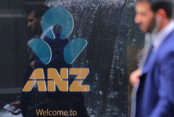 Pedestrians are visible in the windows of the ANZ branch of the Australia-New Zealand Banking Group (ANZ) in central Sydney.