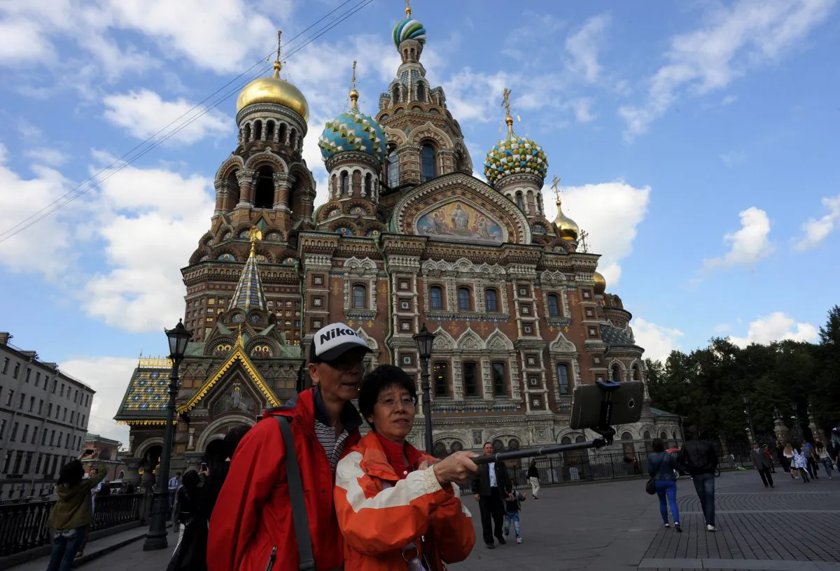 Chinese tourists take a "selfie" in front of Church of the Savior on Blood in central St. Petersburg, Russia, on Sept. 4, 2015. (OLGA MALTSEVA/AFP/Getty Images)