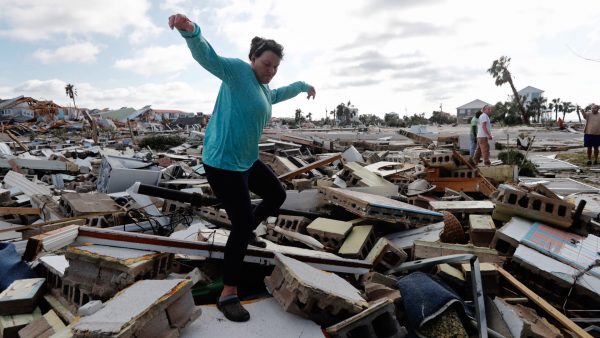 Mishelle climbs rubble home friend