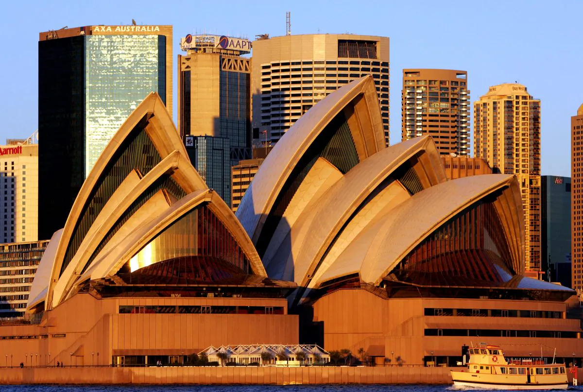 This undated photo shows the Sydney Opera House in front of a city skyline in Sydney, Australia. (Greg Wood/AFP/Getty Images)   