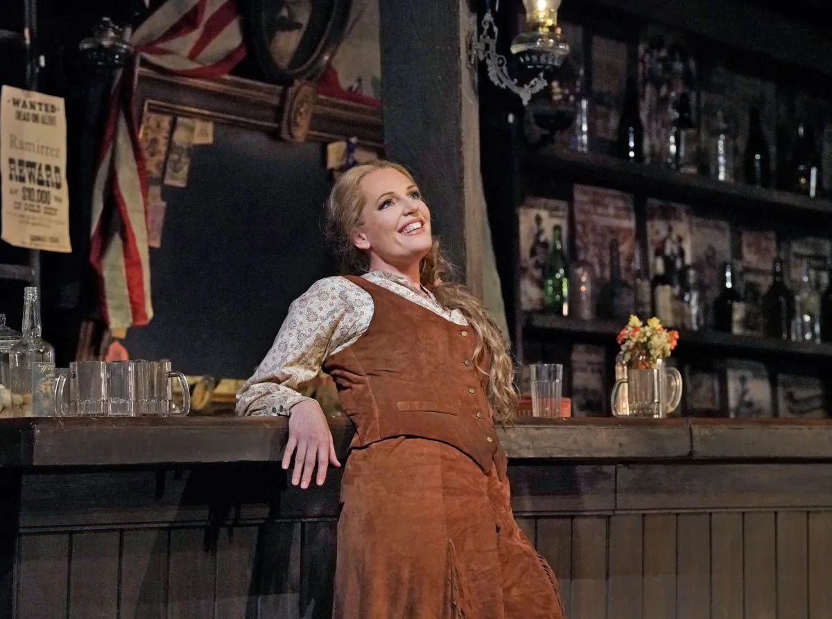 Can one woman tame the wild West? Eva-Maria Westbroek (C) as Minnie in Puccini's "La Fanciulla del West" proves she can. (Ken Howard / The Metropolitan Opera)