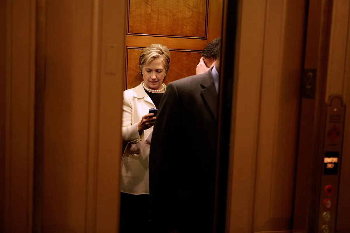Then-Secretary of State-designate and U.S. Senator Hillary Clinton looks at her BlackBerry while on an elevator at the U.S. Capitol January 7, 2009. (Chip Somodevilla/Getty Images)