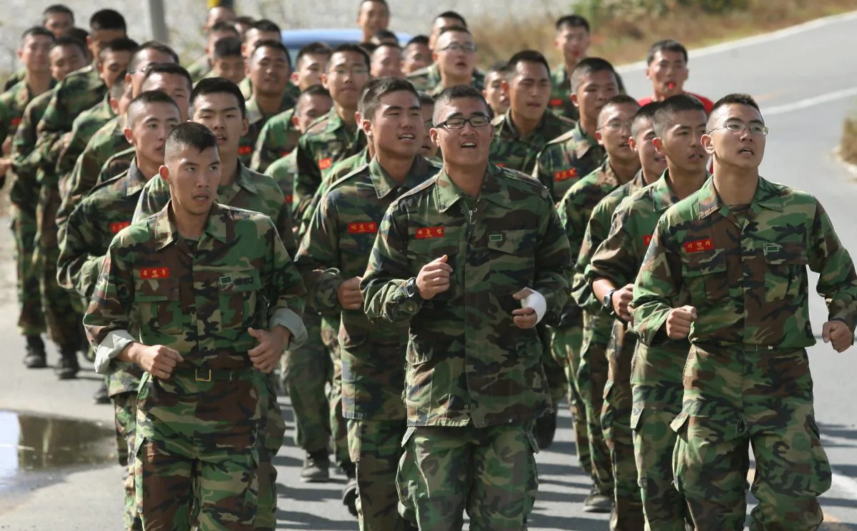 South Korean soldiers take a training run as they prepare for military exercises near the city of Pohang, South Korea, on Oct. 23, 2006. (Mark Ralston/AFP/Getty Images)