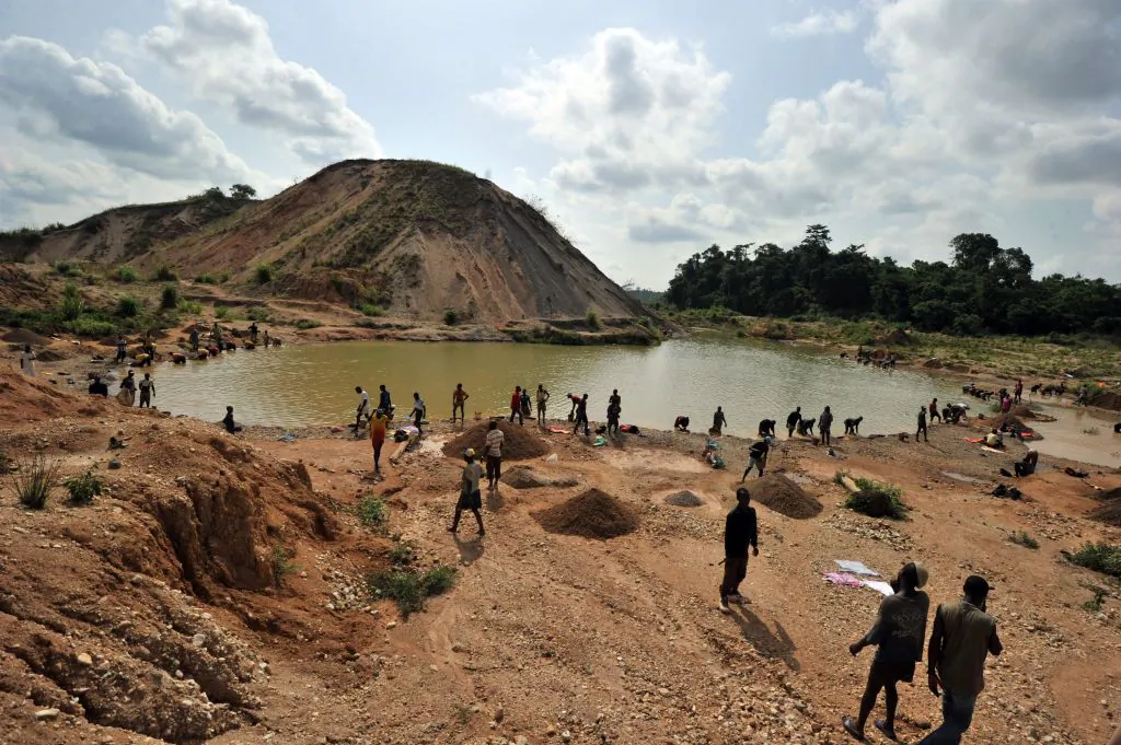 Diamond prospectors filter earth from a river in Koidu, the capital of the diamond-rich Kono district, in eastern Sierra Leone, on April 28, 2012. (Issouf Sanogo/AFP/Getty Images)