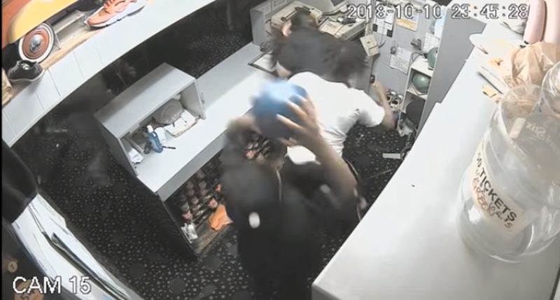 man attacks man with bowling ball