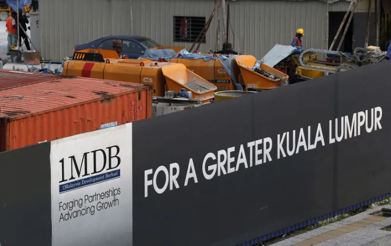 Workmen are pictured on site at the 1Malaysia Development Berhad (1MDB) flagship Tun Razak Exchange development in Kuala Lumpur, Malaysia, on March 1, 2015.   (Olivia Harris/Reuters)