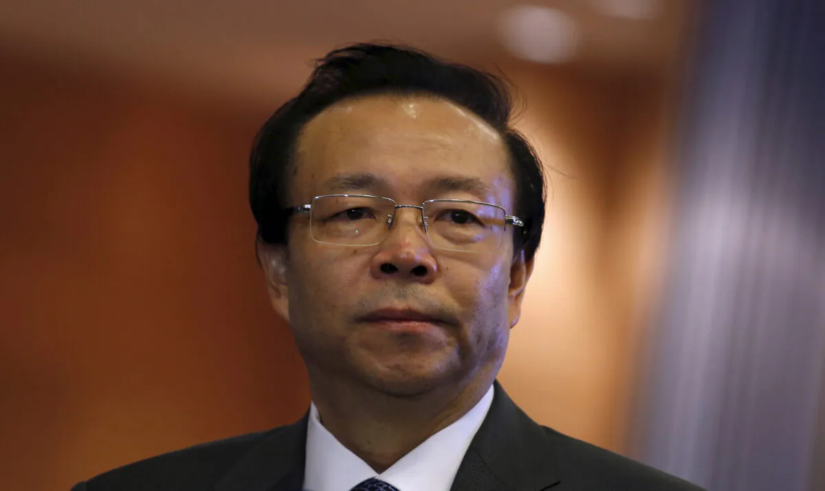Former China Huarong Asset Management Co. chairman Lai Xiaomin listens to a question from a reporter during the debut of the company at the Hong Kong Exchanges in Hong Kong on Oct. 30, 2015. (Bobby Yip/Reuters)
