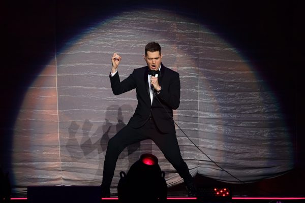 Micahel Buble poses on stage