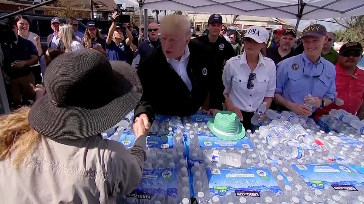 President Donald Trump and First Lady Melania Trump hand out bottles of water-AP