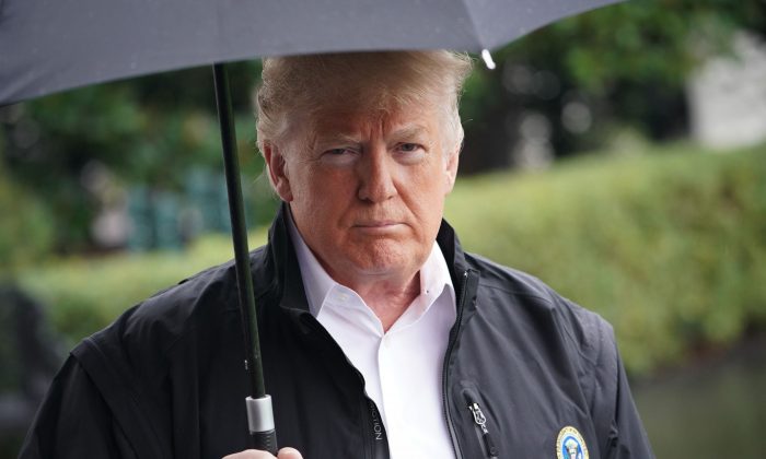 President Donald Trump speaks before boarding Marine One from the South Lawn of the White House in Washington, DC on Oct. 15, 2018. (MANDEL NGAN/AFP/Getty Images)