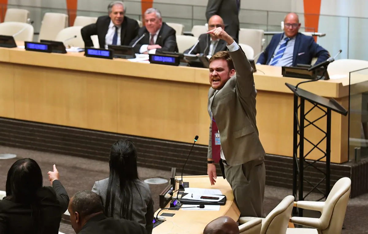 Members of the Permanent Mission of Cuba to the United Nations protest during a meeting at the United Nations on the plight of Cuban political prisoners in New York on Oct. 16, 2018. (TIMOTHY A. CLARY/AFP/Getty Images)