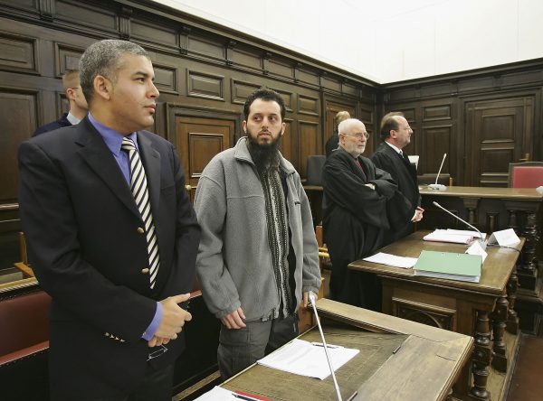 Mounir el-Motassadeq stands with his team of lawyers