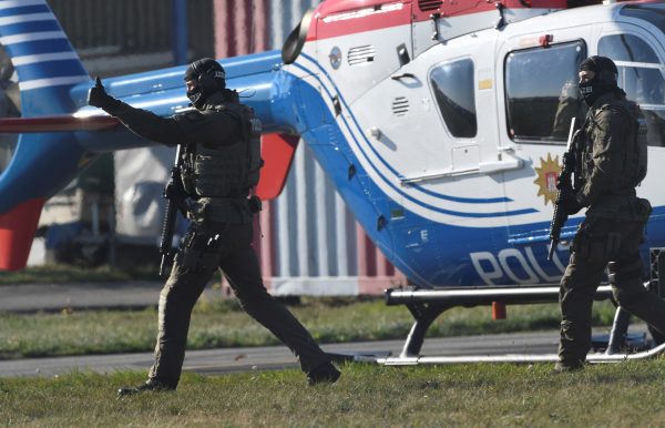 German special police secure the area while Mounir el-Motassadeq is escorted
