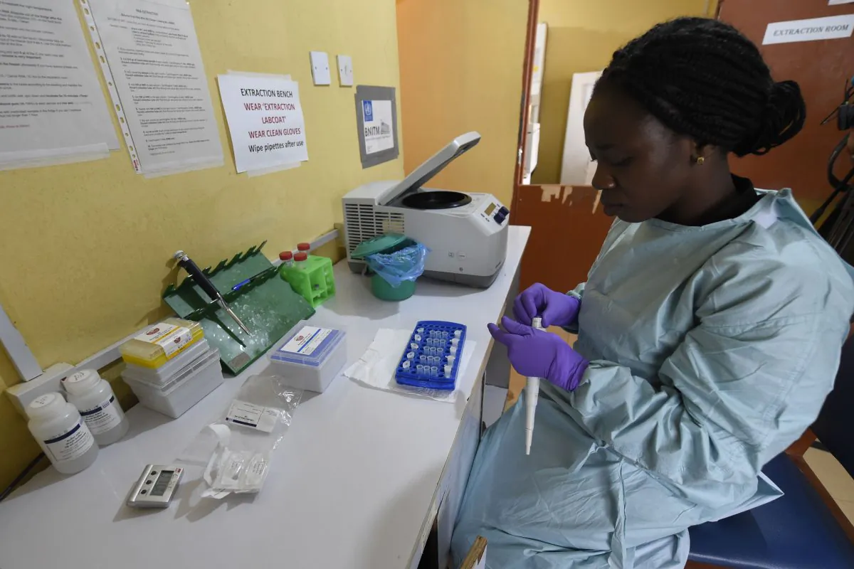 A health official works in the laboratory extraction room of the Institute of Lassa Fever Research and Control in Irrua, Nigeria, on March 6, 2018. (Pius Utomi Ekpei/AFP/Getty Images)