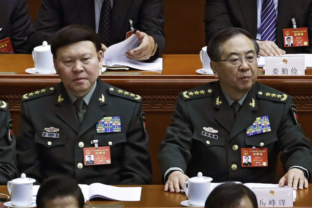Zhang Yang (left), the then-head of China's People's Liberation Army (PLA) political affairs department, and Fang Fenghui (right), the then-chief of the general staff of the Chinese People's Liberation Army attend China's National People's Congress (NPC) at the Great Hall of the People in Beijing on March 8, 2017. (Andy Wong/AP)
