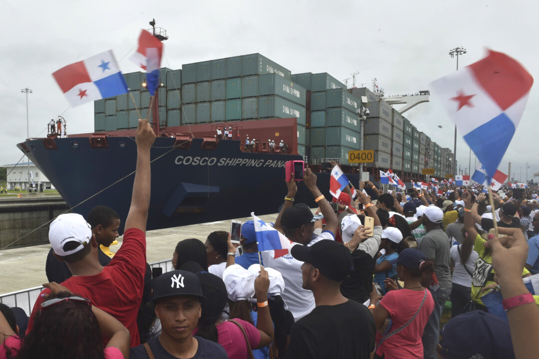 Chinese-chartered merchant ship Cosco Shipping Panama crosses the new Agua Clara Locks during the inauguration of the expansion of the Panama Canal in this file photo. China is continuing its push to displace U.S. influence in the region and has already put parts of the Panama Canal under its control. (Rodrigo Arangua/AFP/Getty Images)