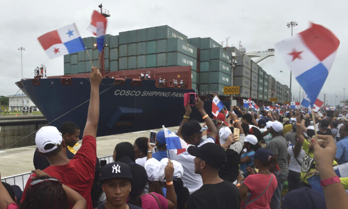 Chinese-chartered merchant ship Cosco Shipping Panama crosses the new Agua Clara Locks during the inauguration of the expansion of the Panama Canal in this undated file photo. China is continuing its push to displace U.S. influence in the region and already has put parts of the Panama Canal under its control. (Rodrigo Arangua/AFP/Getty Images)
