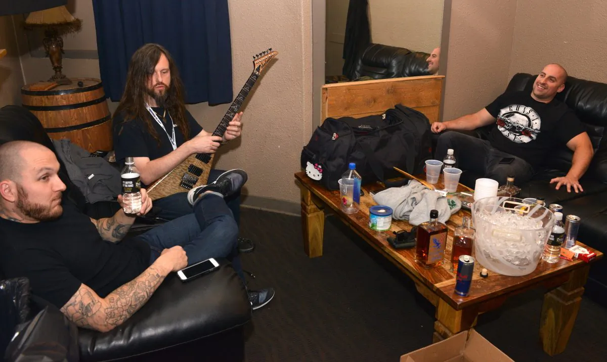 Oli Herbert (center) and other members of the band "All that Remains" hangs out before their performance at the Freedom On Festival at the Grizzly Rose in Denver, Colorado, on Oct. 14, 2016. (Photo by Tom Cooper/Getty Images for Freedom On Festival)