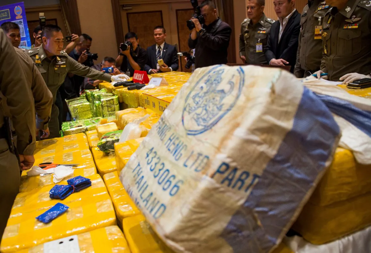 Royal Thai national police chief general Chaktip Chaijinda (2nd-L) inspects seized drugs and guns during a press conference in Bangkok on May 11, 2018.(ROMEO GACAD/AFP/Getty Images)