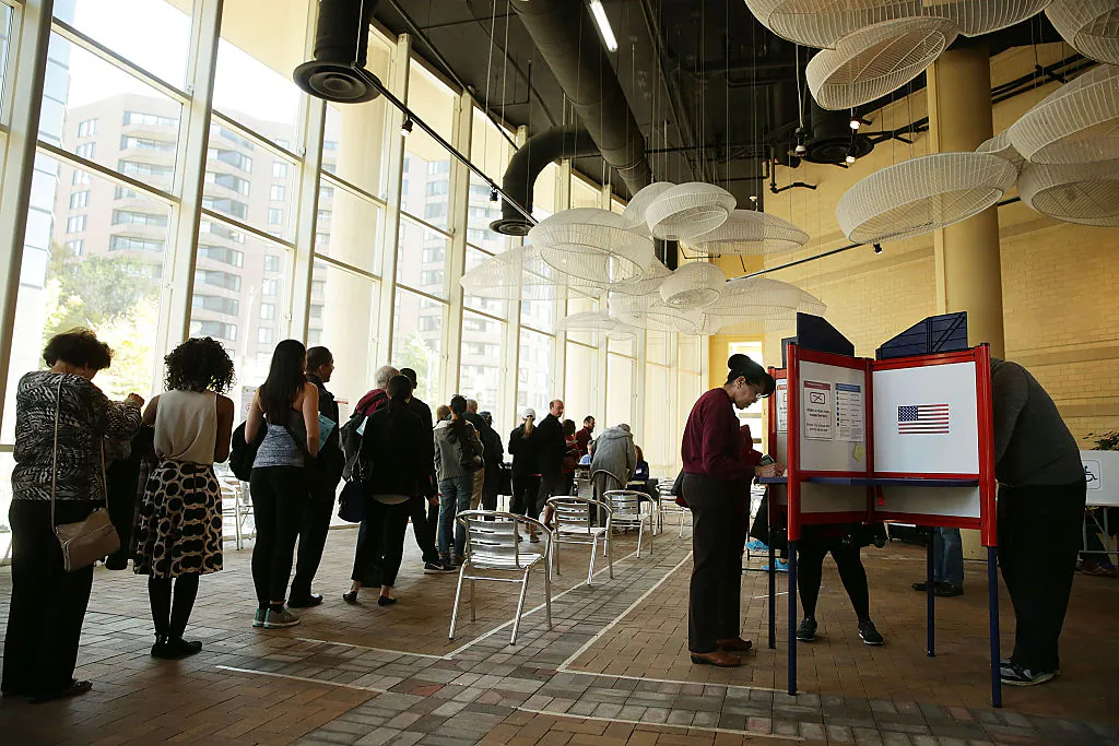Voters wait in line to cast their ballots in a polling place on Election Day on Nov. 8, 2016 in Arlington, V.A.. (Alex Wong/Getty Images)