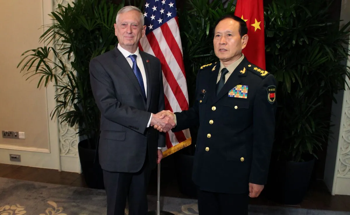 U.S. Defense Secretary Jim Mattis shakes hands with his Chinese counterpart General Wei Fenghe during a meeting on the sidelines of the Association of Southeast Asian Nations (ASEAN) security summit in Singapore on Oct. 18, 2018. (Thomas Watkins / AFP/Getty Images)