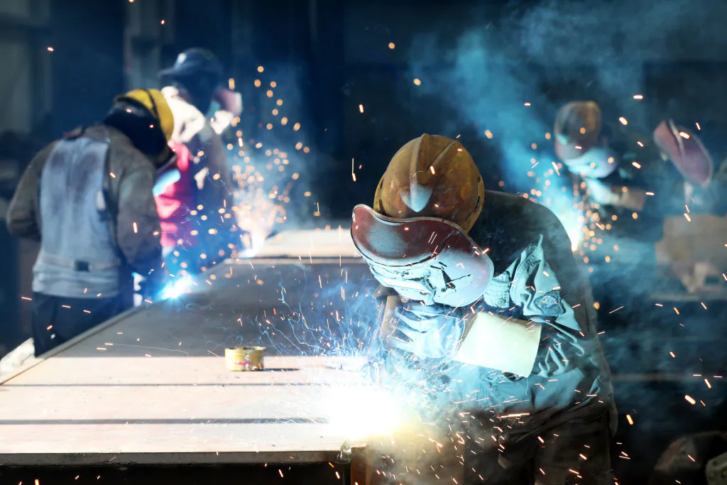 Workers cut steel at a factory in Huaibei, a city in eastern China's Anhui Province, on May 3, 2018. (AFP/Getty Images)