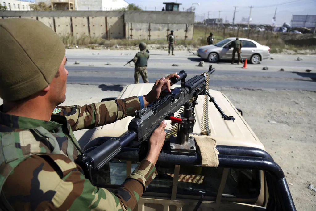 Afghan National army soldiers search a car at a checkpoint ahead of parliamentary elections scheduled for Oct. 20, at the Independent Election Commission compound in Kabul, Afghanistan, Wednesday, Oct. 17, 2018. (AP Photo/Rahmat Gul)