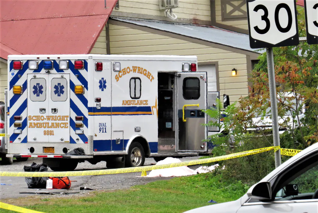 A body is draped under a blanket at the scene of a fatal crash in Schoharie, N.Y. on Oct. 6, 2018 (Tom Heffernan Sr. via AP)