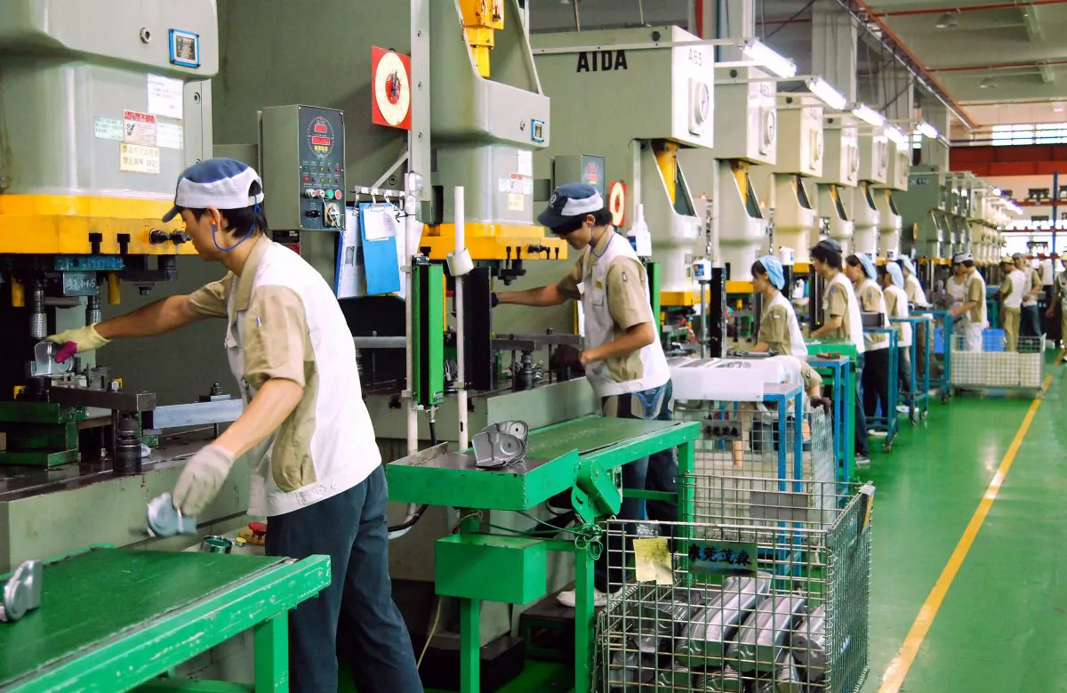Chinese workers produce various components at the Mansfield Manufacturing plant in Dongguan, southern China's Guangdong province on October 20, 2008. At least 2.7 million factory workers in southern China could lose their jobs as the global economic crisis hits demand for electronics, toys and clothes, as the region has seen massive export-driven expansion in recent years by supplying the world with cheap consumer goods, but rising production costs and falling US and European demand have marked a swift end to the boom.       AFP PHOTO (Photo credit should read STR/AFP/Getty Images)
