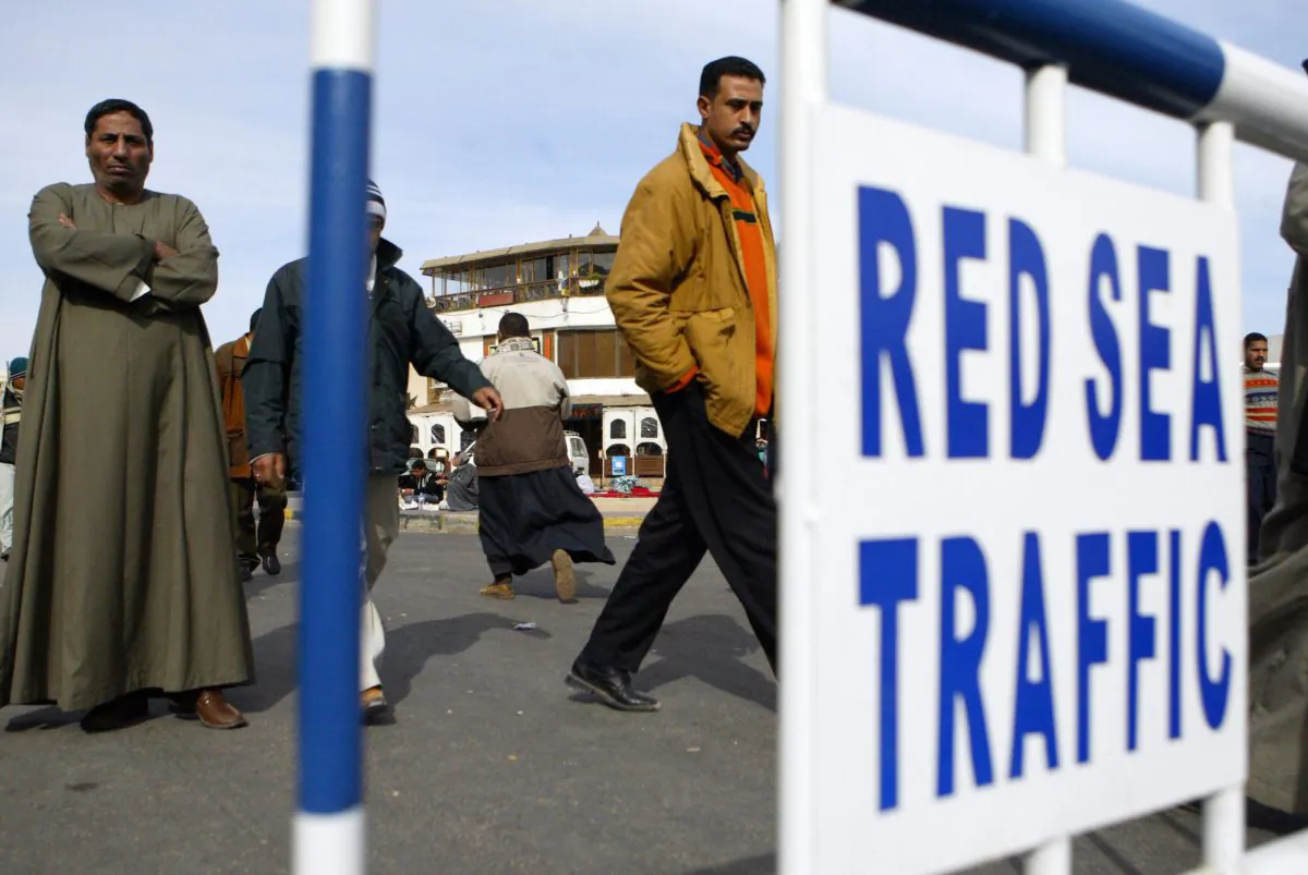 Egyptian men in front of the Hurghada hospital in Egypt, Feb. 7, 2006. (Khaled Desouki/AFP/Getty Images)