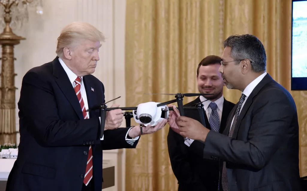 President Donald Trump holds a drone as George Mathew CEO & Chairman of Kespry explains how it works during  the American Leadership in Emerging Technology Event in the East Room of the White House in Washington, June 22, 2017 (Olivier Douliery-Pool/Getty Images)