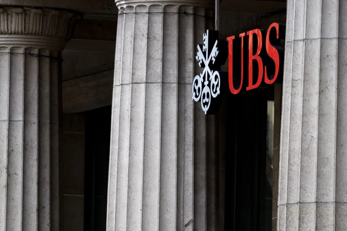 A sign of Swiss banking giant UBS is seen on October 6, 2018 at a branch in Lausanne. (FABRICE COFFRINI/AFP/Getty Images)