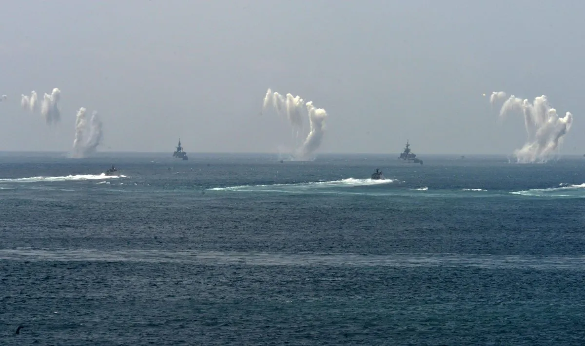 Smoke rises from the sea to mark electronic counter-measures (ECM) during the "Han Kuang" (Han Glory) life-fire drill, some 7 kms (4 miles) from the city of Magong on the outlying Penghu islands on May 25, 2017. (SAM YEH/AFP/Getty Images)