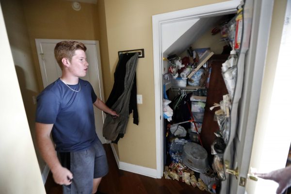 Mike Maddox, quarterback for the Mosley High football team, shows the closet in which he hid
