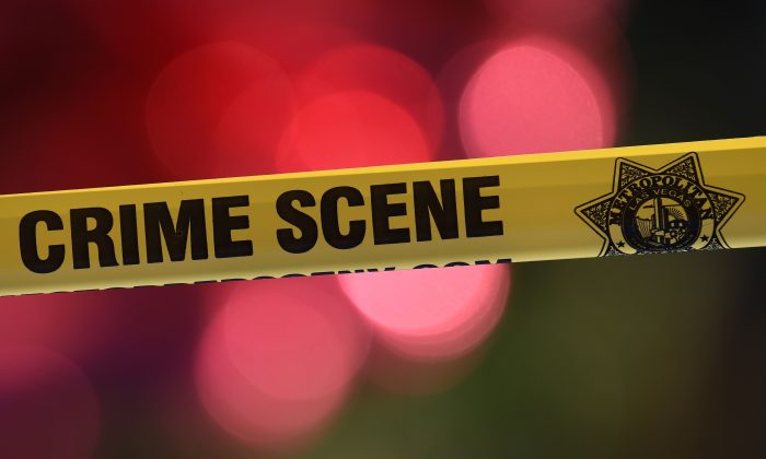 Stock photo of police tape marking a crime scene. (Mark Ralston/AFP/Getty Images)