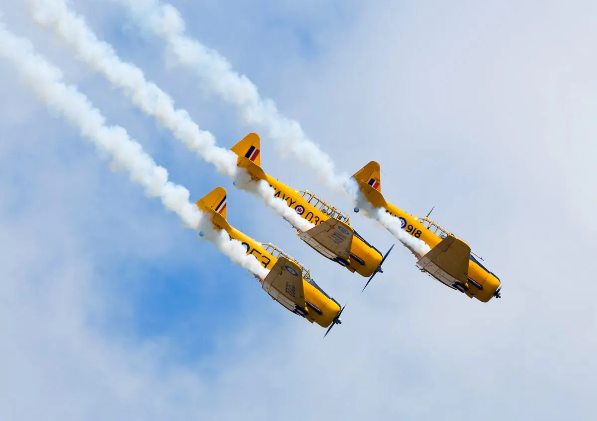 Three Harvard aircraft dive in formation at the Windsor International Airport. (Darren Brode/Shutterstock.com)