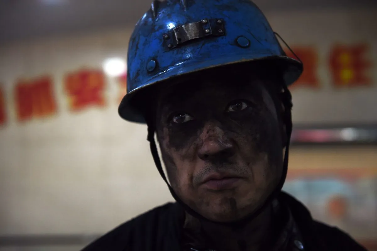 A miner is seen after his shift at a coal mine in China. (GREG BAKER/AFP/Getty Images)