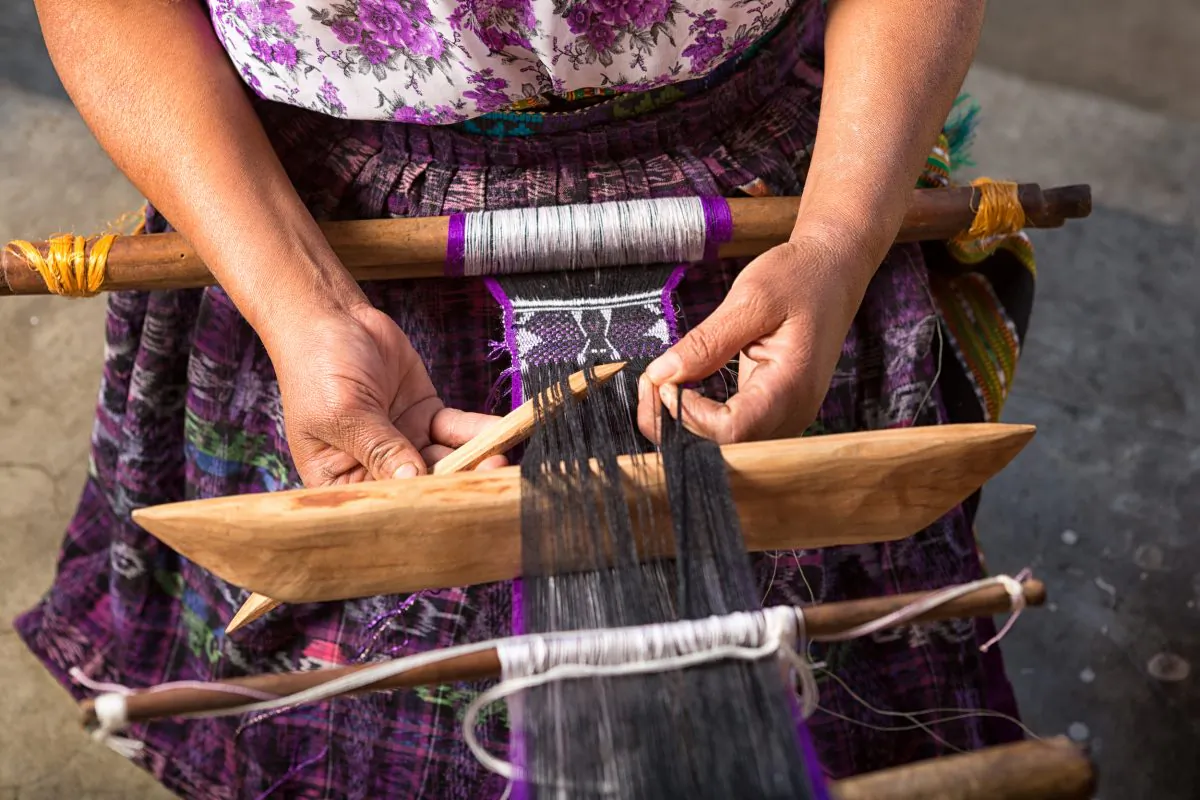 Maya woman making a traditional belt. (Shutterstock) 