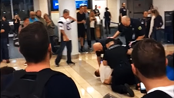 Orlando Police handcuffed Strong