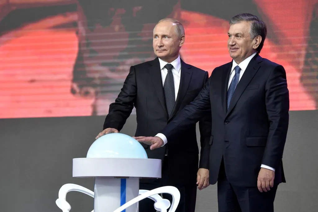Russian President Vladimir Putin (L) and President of Uzbekistan Shavkat Mirziyoyev, inaugurate the construction of the first nuclear power plant, during a forum of inter-regional cooperation between Russia and Uzbekistan in Tashkent on Oct. 19, 2018. (Alexey Nikolsky/AFP/Getty Images)