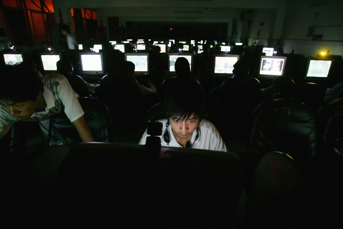 A Chinese man plays online games at an internet cafe in Wuhan, China, in this file photo. The Chinese regime's cyber strategy is not fun and games, however, it is real cyber war against the United States.  (Cancan Chu/Getty Images)