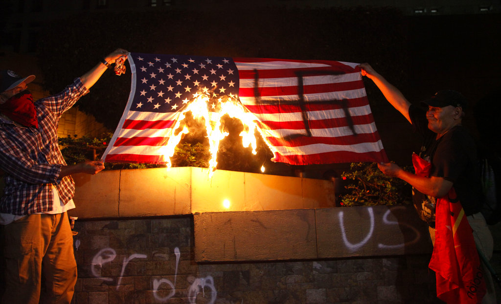 Hondurans burn American flag outside embassy