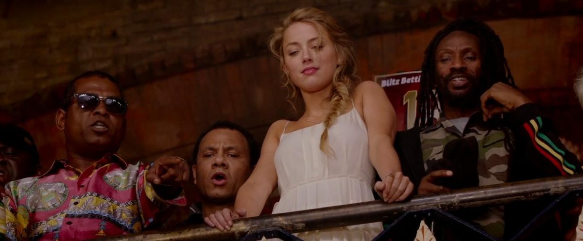 Amber Heard stands at balcony