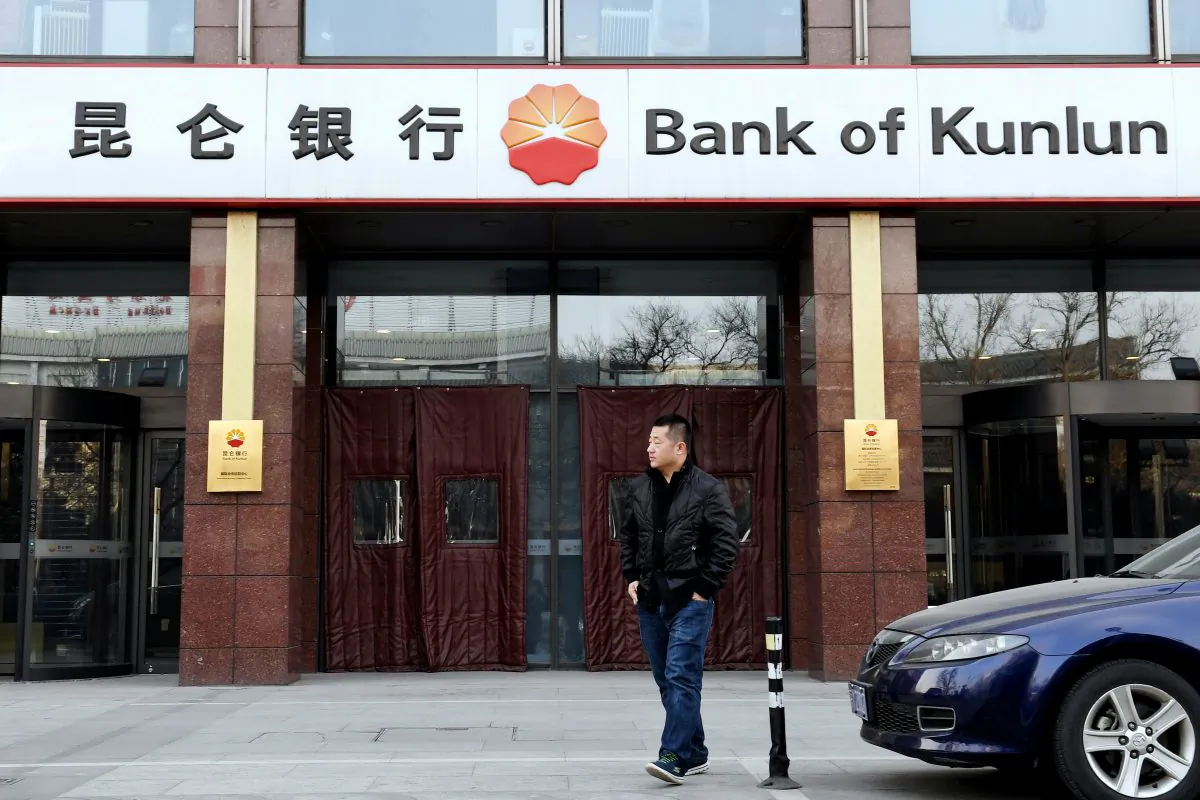 A man walks past a Bank of Kunlun branch in Beijing, on Jan. 12, 2017. (Reuters/Stringer)