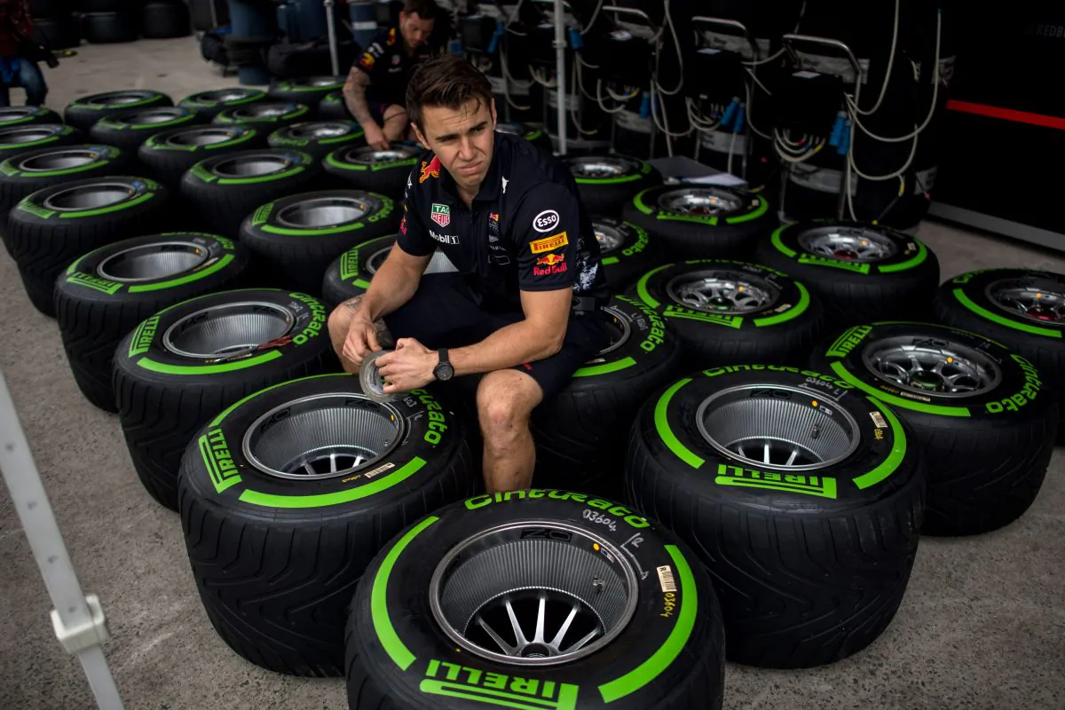 A staff member at the Formula One Chinese Grand Prix working with Pirelli tires in Shanghai on April 6, 2017. (Johannes Eisele/AFP/Getty Images)