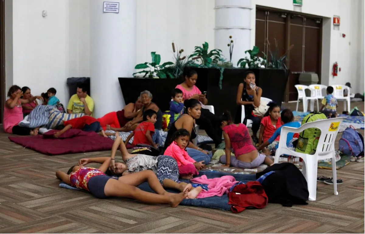 People who were evacuated from their homes are seen in a big room at the Convention Center being used as a shelter while Hurricane Willa approaches the Pacific beach resort, Mexico Oct. 23, 2018. (Reuters/Henry Romero)
