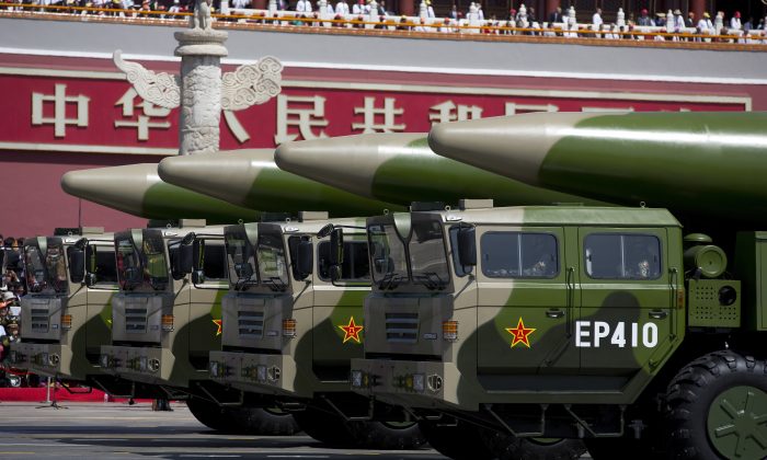 Military vehicles carrying DF-26 ballistic missiles drive past the Tiananmen Gate during a military parade in Beijing on Sept. 3, 2015. (Andy Wong/Pool /Getty Images)